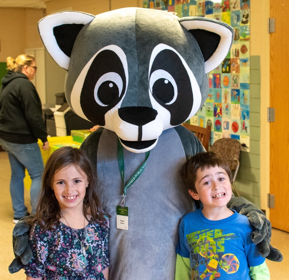 Roy the Raccoon with students