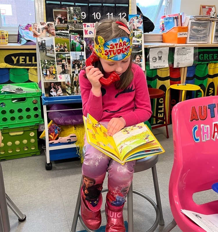 Using a fluency phone to listen to herself read￼
