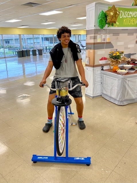 student on smoothie bike