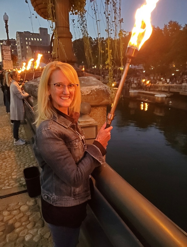 Jessica DeRemer with the torch