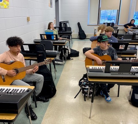 students playing guitar